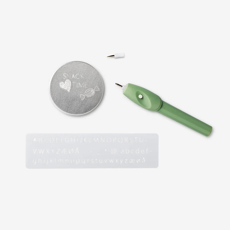 Engraving pen. With stencils and a replaceable tip