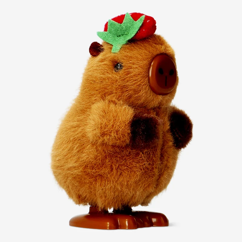 Wind up capybara with strawberry hat