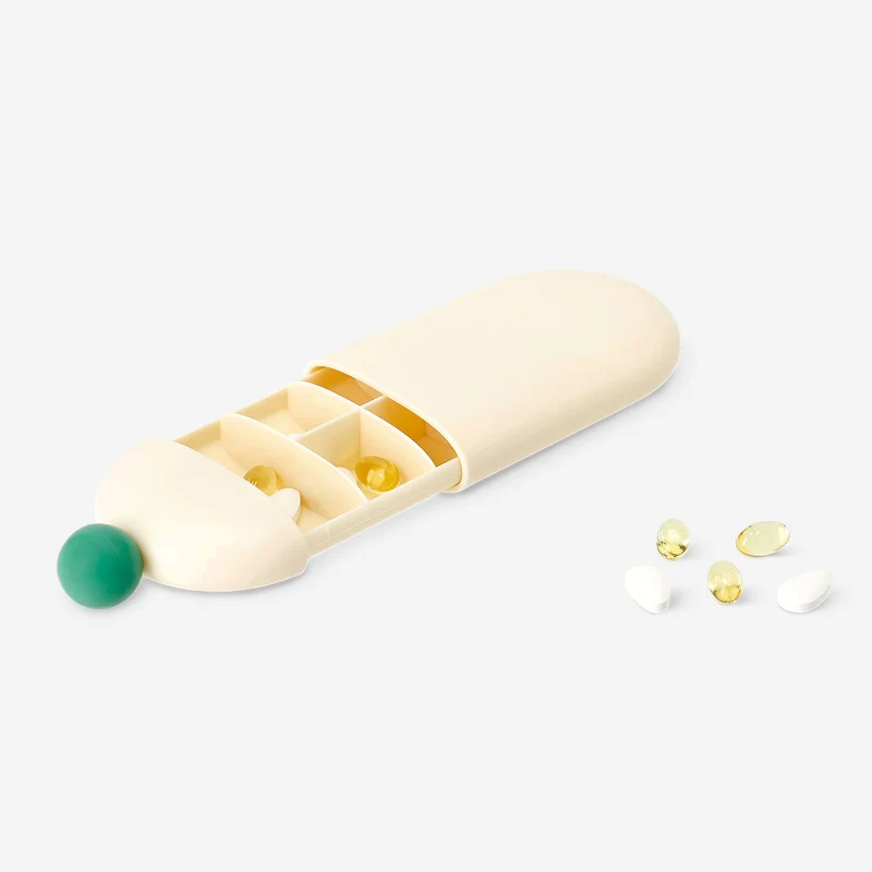 Pill organiser with slide mechanism